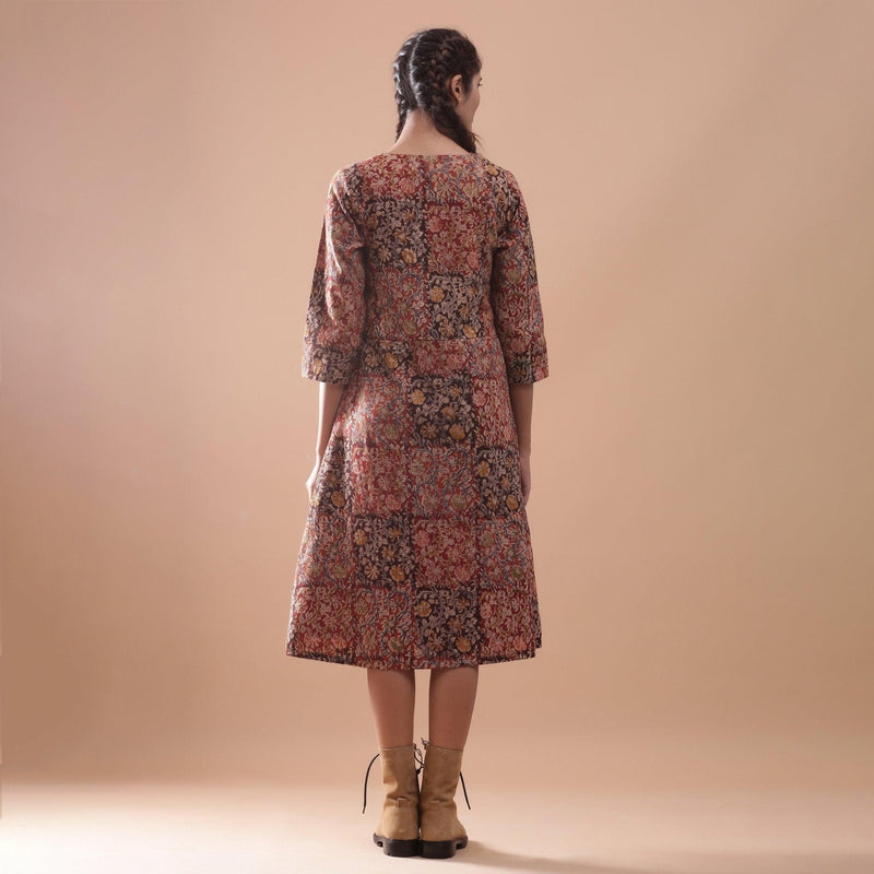 Back View of a Model wearing Flannel Kalamkari Muddy Red V-Neck Dress