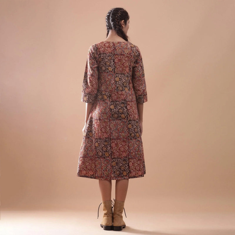 Back View of a Model wearing Warm Block Printed Muddy Red Cotton Midi Dress