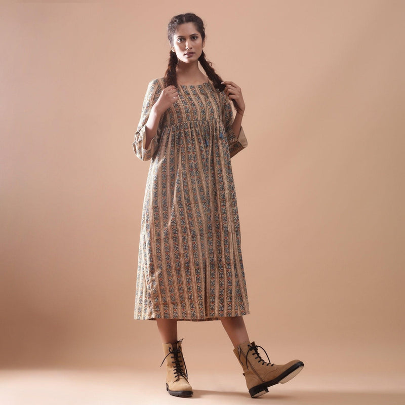 Front View of a Model wearing Warm Gathered Kalamkari Midi Dress