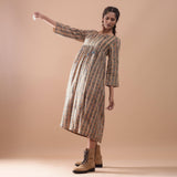 Left View of a Model wearing Warm Gathered Kalamkari Midi Dress