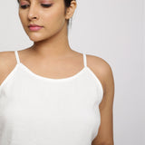 Front Detail of a Model wearing White 100% Cotton Relaxed Fit Spaghetti Top