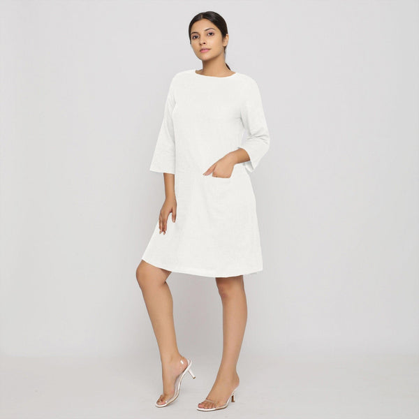 Front View of a Model wearing White Yoked Cotton Tunic Dress