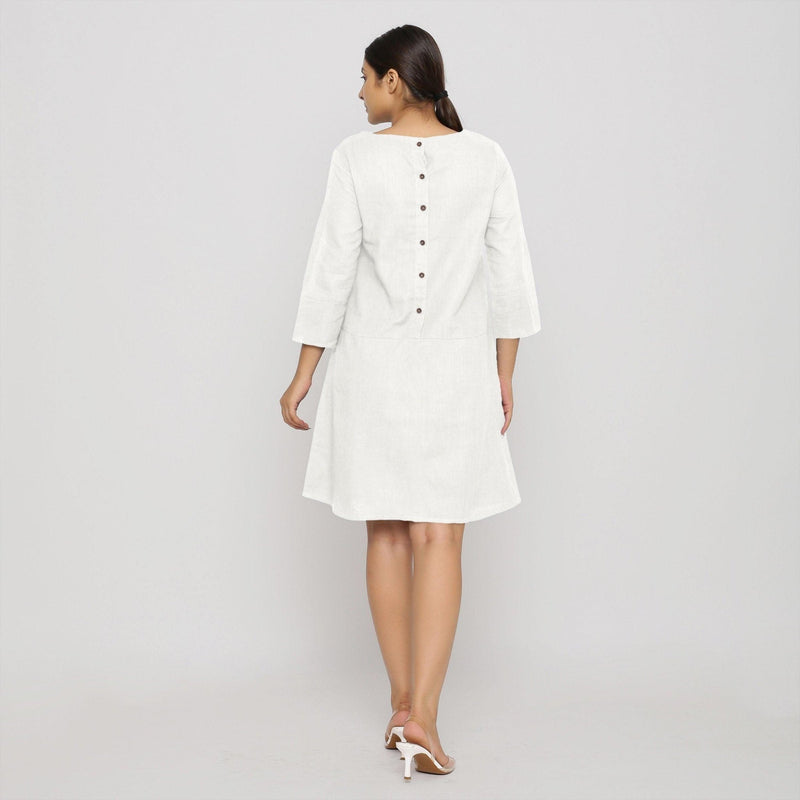 Back View of a Model wearing White Yoked Cotton Tunic Dress