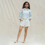 Front View of a Model wearing White and Powder Blue Paisley Block Printed Cotton Button-Down Shirt