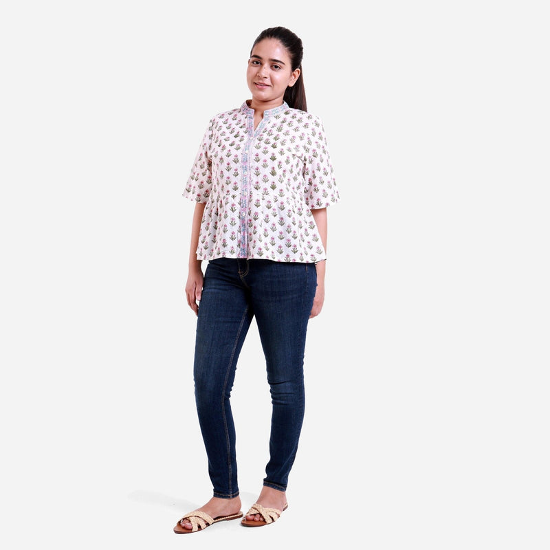 Front View of a Model wearing White Button-Down Flared Cotton Top