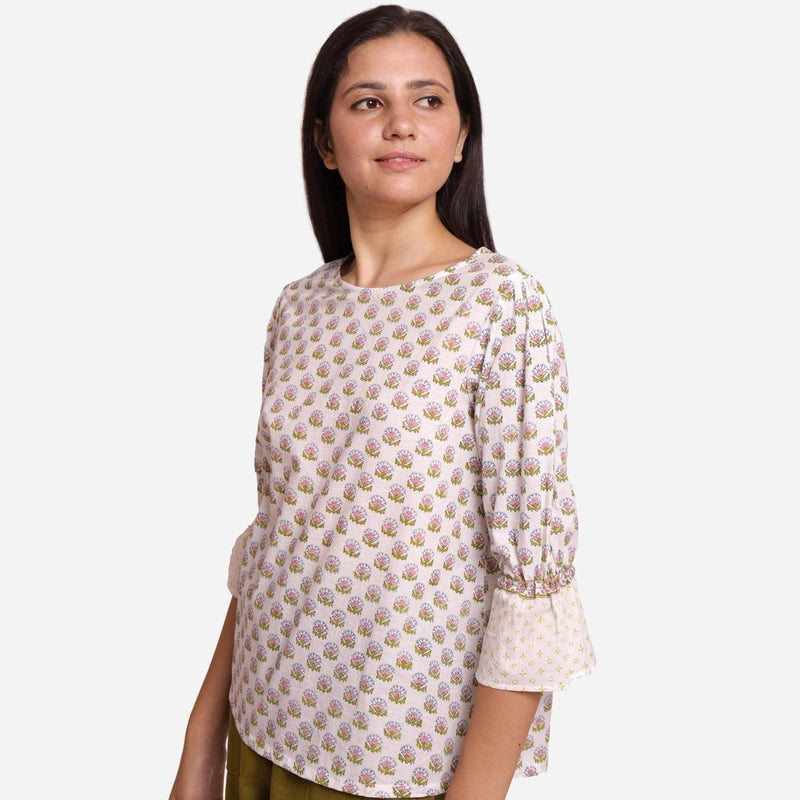 Left View of a Model wearing Block Printed Frilled Puff Sleeves Top