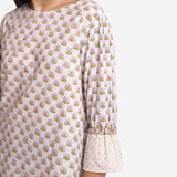 Left Detail of a Model wearing Block Printed Frilled Puff Sleeves Top