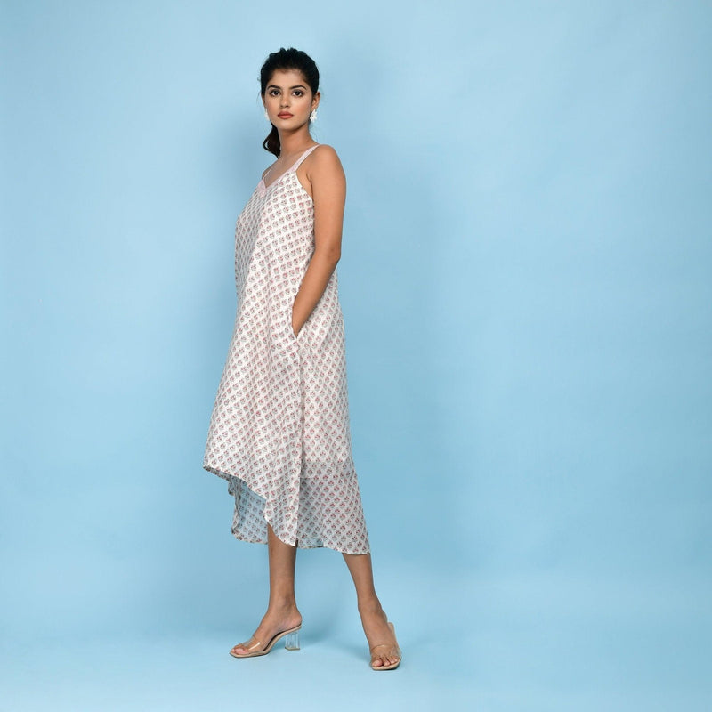 Left View of a Model wearing White Block Printed 100% Cotton High-Low Cami Dress