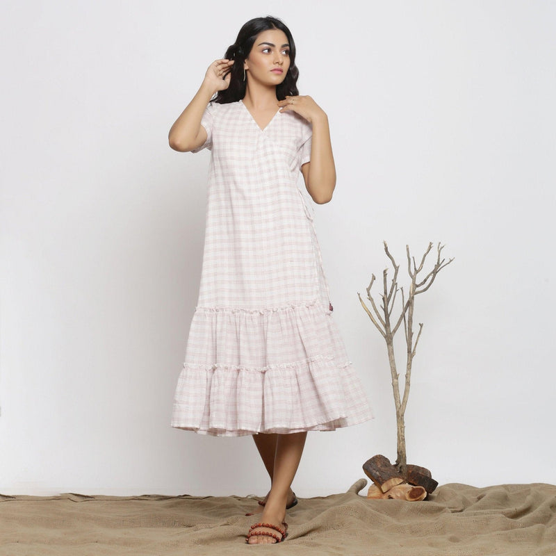 Front View of a Model wearing White And Pink Handspun Wrap Dress