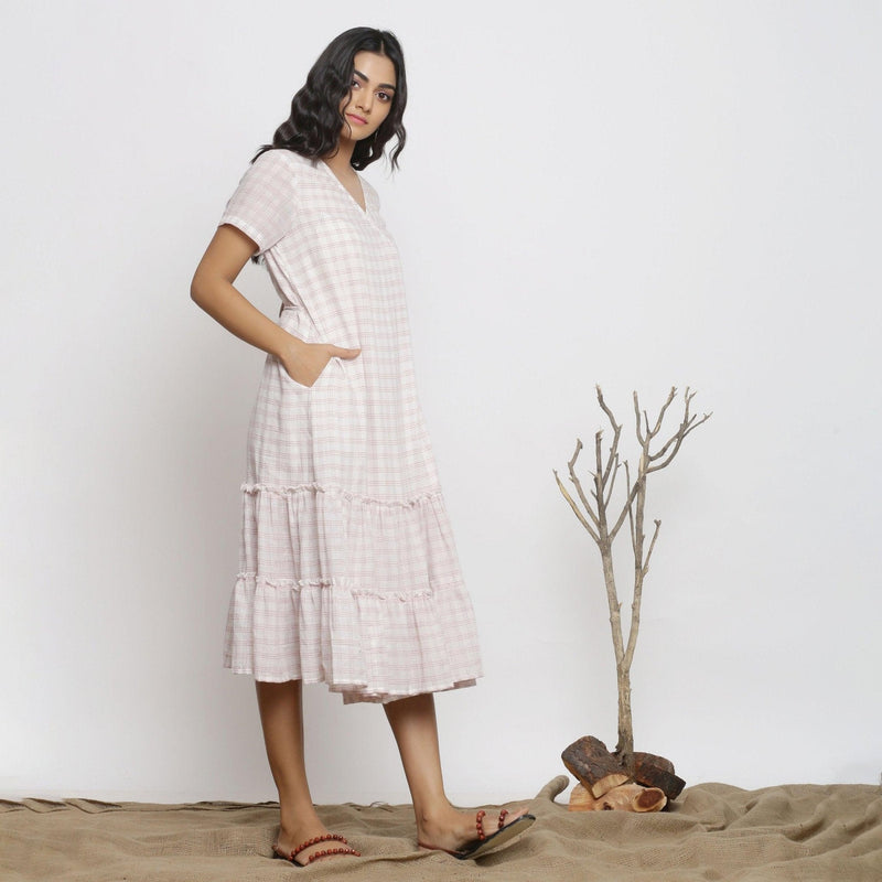 Right View of a Model wearing White And Pink Handspun Wrap Dress