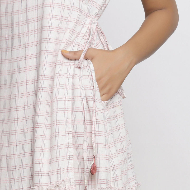 Left Detail of a Model wearing White And Pink Handspun Wrap Dress