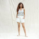 Front View of a Model wearing White Cotton Corduroy High-Rise Elasticated Baggy Shorts