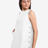 Front Detail of a Model wearing White Cotton Flax Kangaroo Pocket Dress