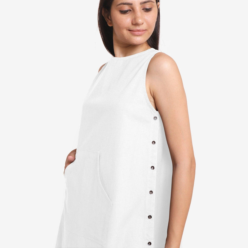 Front Detail of a Model wearing White Cotton Flax Kangaroo Pocket Dress