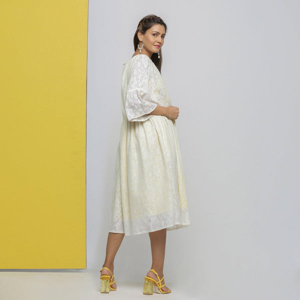 Back View of a Model wearing White Cotton Hand-Embroidered Yoked Dress