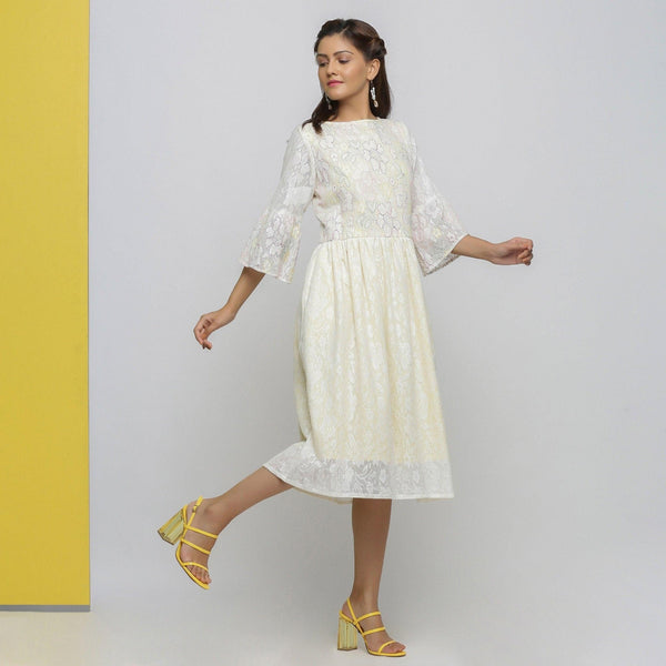 Right View of a Model wearing White Cotton Hand-Embroidered Yoked Dress