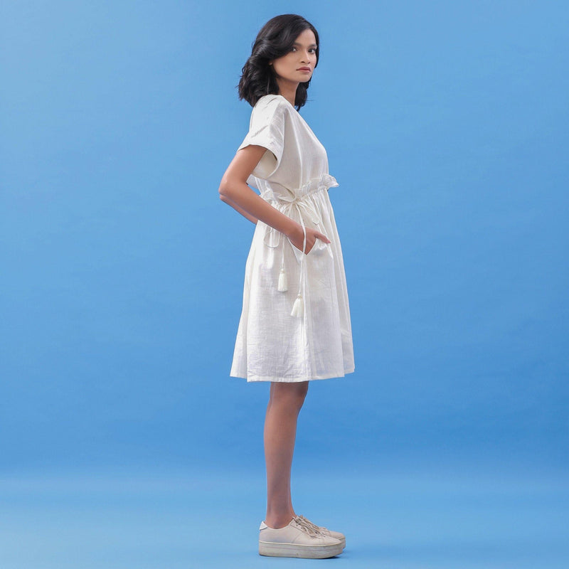 Right View of a Model wearing White Cotton V-Neck Frilled Bohemian Dress