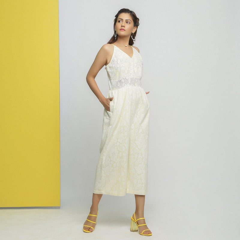 Right View of a Model wearing White Cotton Floral Straight Jumpsuit