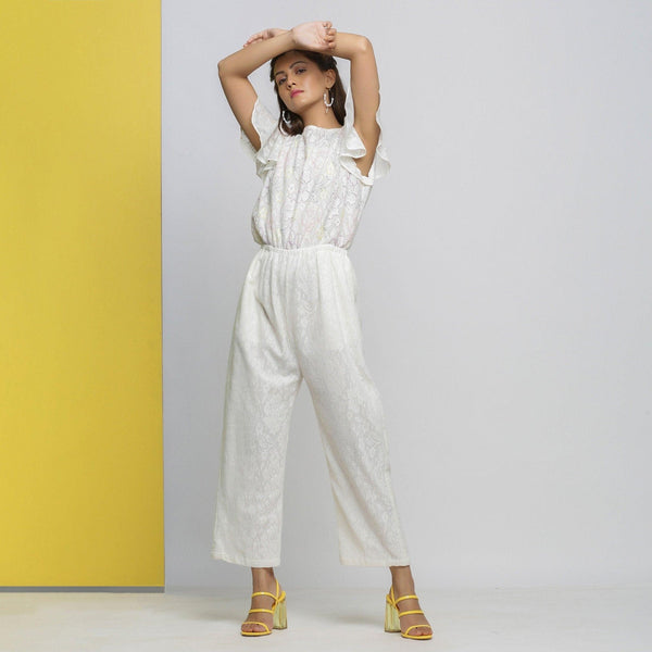 Front View of a Model wearing White Cotton Lace Hand Embroidered Jumpsuit