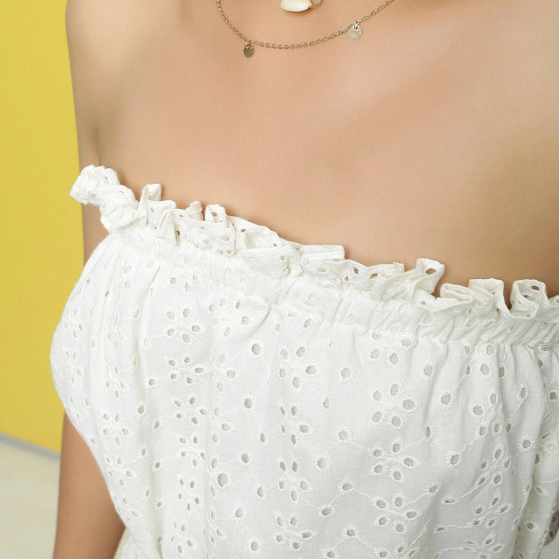 Front Detail of a Model wearing White Cotton Schiffli Floral Elasticated Tube Neck Jumpsuit