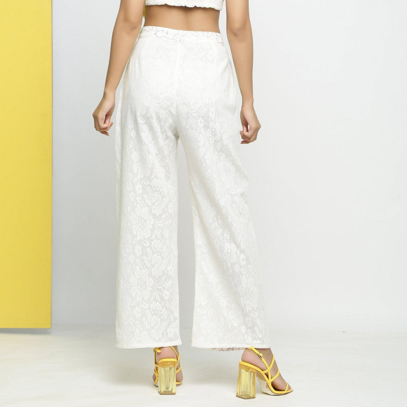 Back View of a Model wearing White Cotton Schiffli Paneled Pant