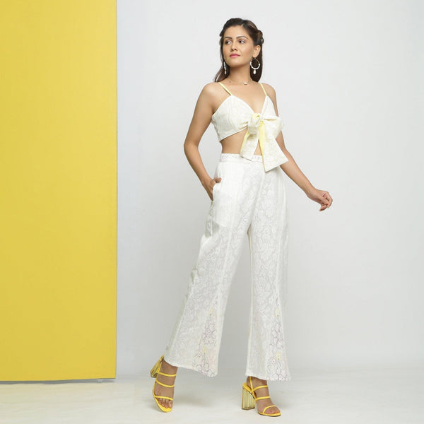 Right View of a Model wearing White Cotton Schiffli Paneled Pant