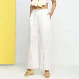 Front View of a Model wearing White Embroidered Cotton Lace Mid-Rise Paneled Pant