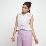 Front View of a Model wearing Block Printed Button-Down Peplum Top