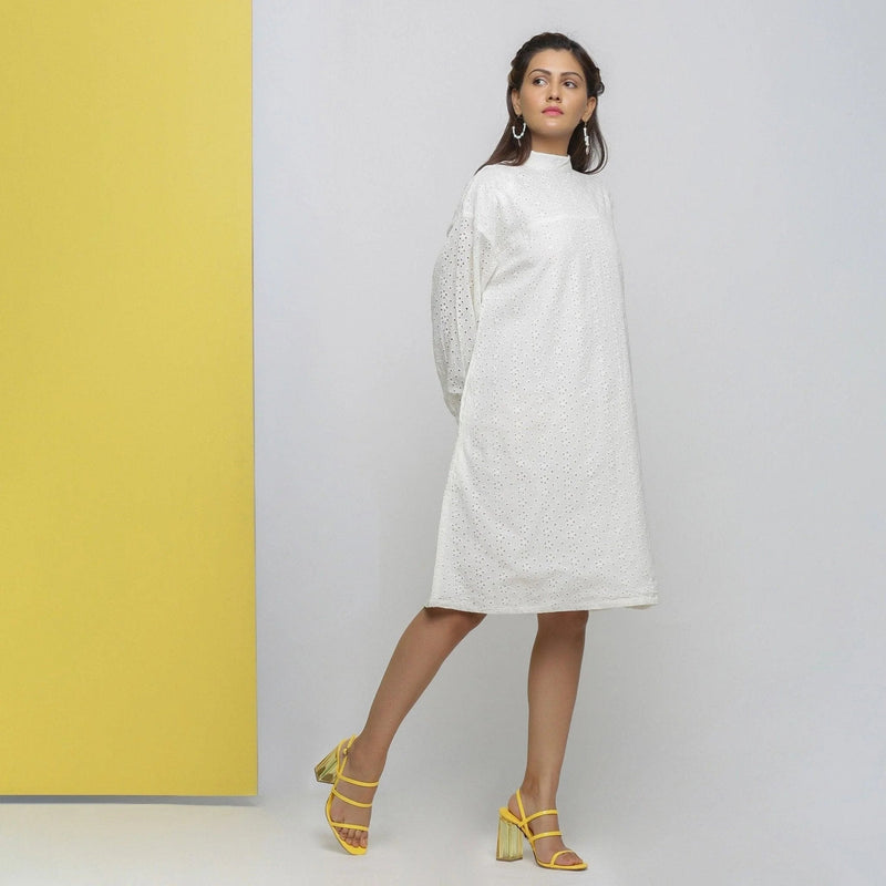 Right View of a Model wearing White Floral Cotton Schiffli Knee Length Stand Collar Dress