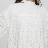 Front Detail of a Model wearing White Floral Cotton Schiffli Knee Length Stand Collar Dress