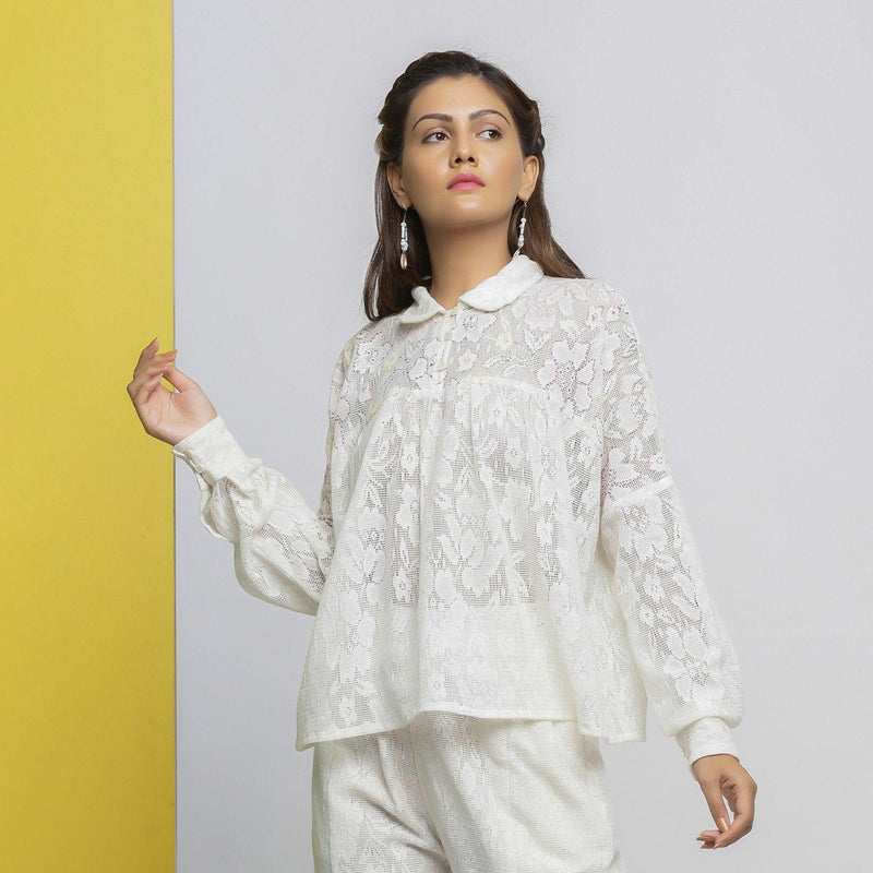 Front View of a Model wearing White Floral Hand-Embroidered Cotton Lace Yoked Shirt