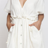 Front Detail of a Model wearing Frilled White Deep Neck Bohemian Dress