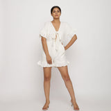 Front View of a Model wearing White Frilled Sleeve Cotton Playsuit