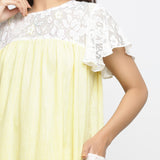 Front Detail of a Model wearing White Hand-Embroidered Cotton Lace Midi Yoked Dress