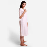 Right View of a Model wearing White Hand Embroidered Cotton U-Neck Midi Slit Dress