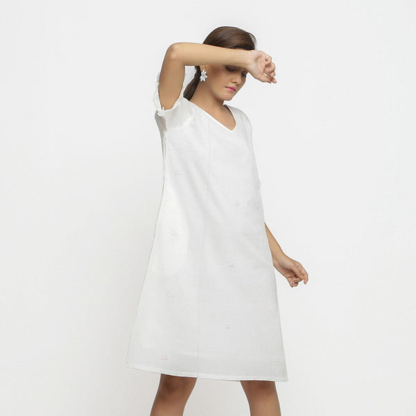 Right View of a Model wearing White Hand Embroidered Organic Cotton Knee Length Shift Dress