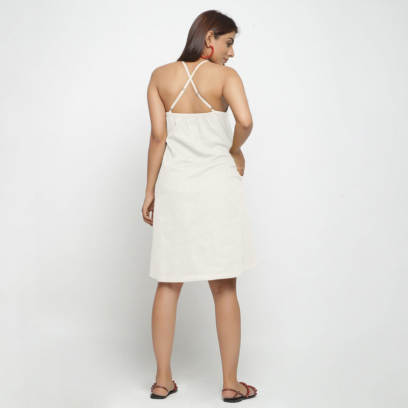 Back View of a Model wearing White Criss-Cross Cotton A-Line Dress