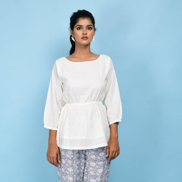 Front View of a Model wearing White Organic Cotton Relaxed Sleeves Peplum Top