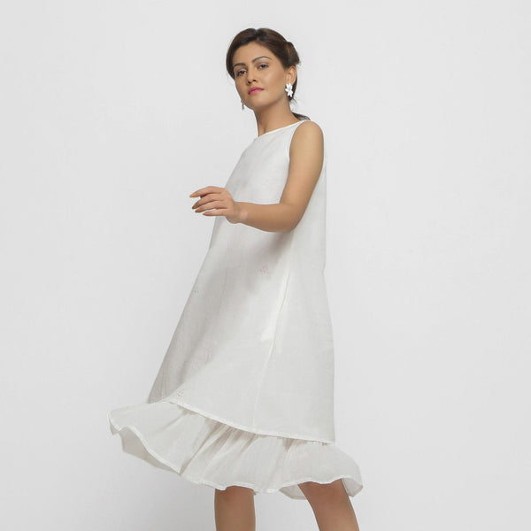 Left View of a Model wearing White Embroidered Cotton A-Line Dress