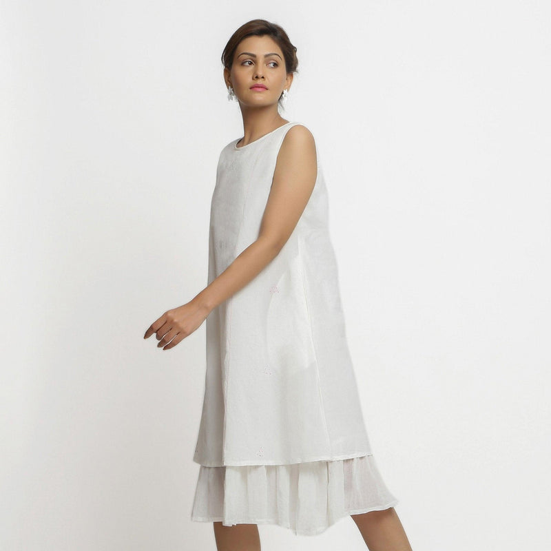 Left View of a Model wearing White Organic Cotton A-Line Knee Length Dress