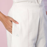 Front Detail of a Model wearing Organic Cotton White Embroidered Straight Pant