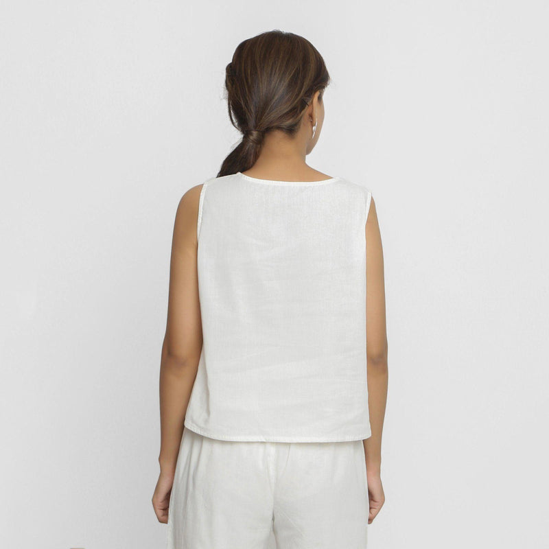 Back View of a Model wearing White Embroidered Organic Cotton Top