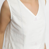 Front Detail of a Model wearing White Embroidered Organic Cotton Top