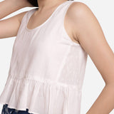 Front Detail of a Model wearing White Round Neck 100% Cotton Peplum Crop Top