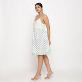 Left View of a Model wearing White Sanganeri Block Printed Cotton Camisole Dress