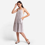 Left View of a Model wearing White Yarn Dyed Cotton Camisole Dress