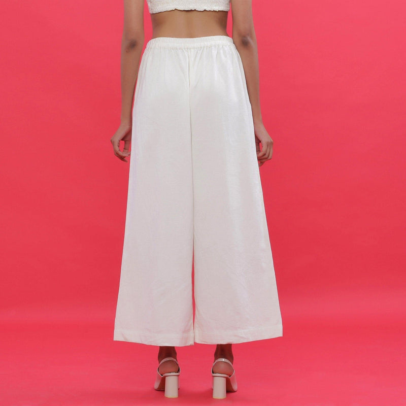 Back View of a Model wearing White Corduroy Slit Wide-Leg Pant