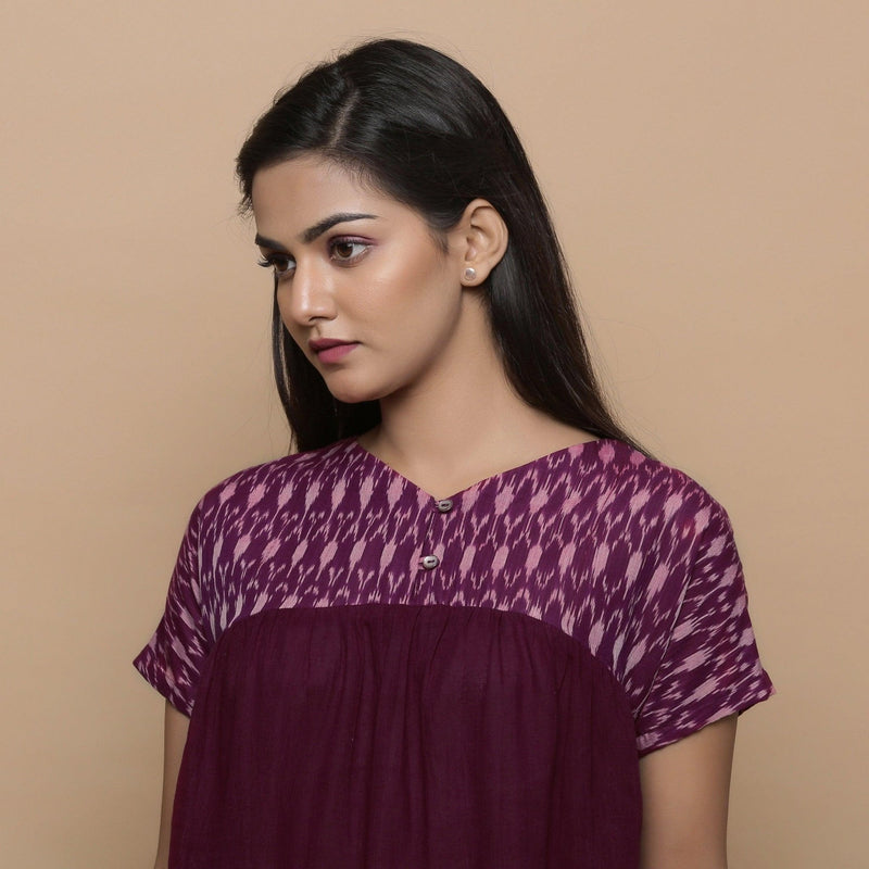 Front Detail of a Model wearing Wine Handspun Cotton Muslin V-Neck Gathered Yoke Top