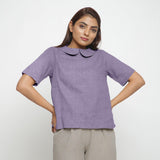 Front View of a Model wearing Wisteria 100% Linen Peter Pan Collar Top