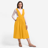 Front View of a Model wearing Yellow Deep Neck Pinafore Midi Wrap Dress